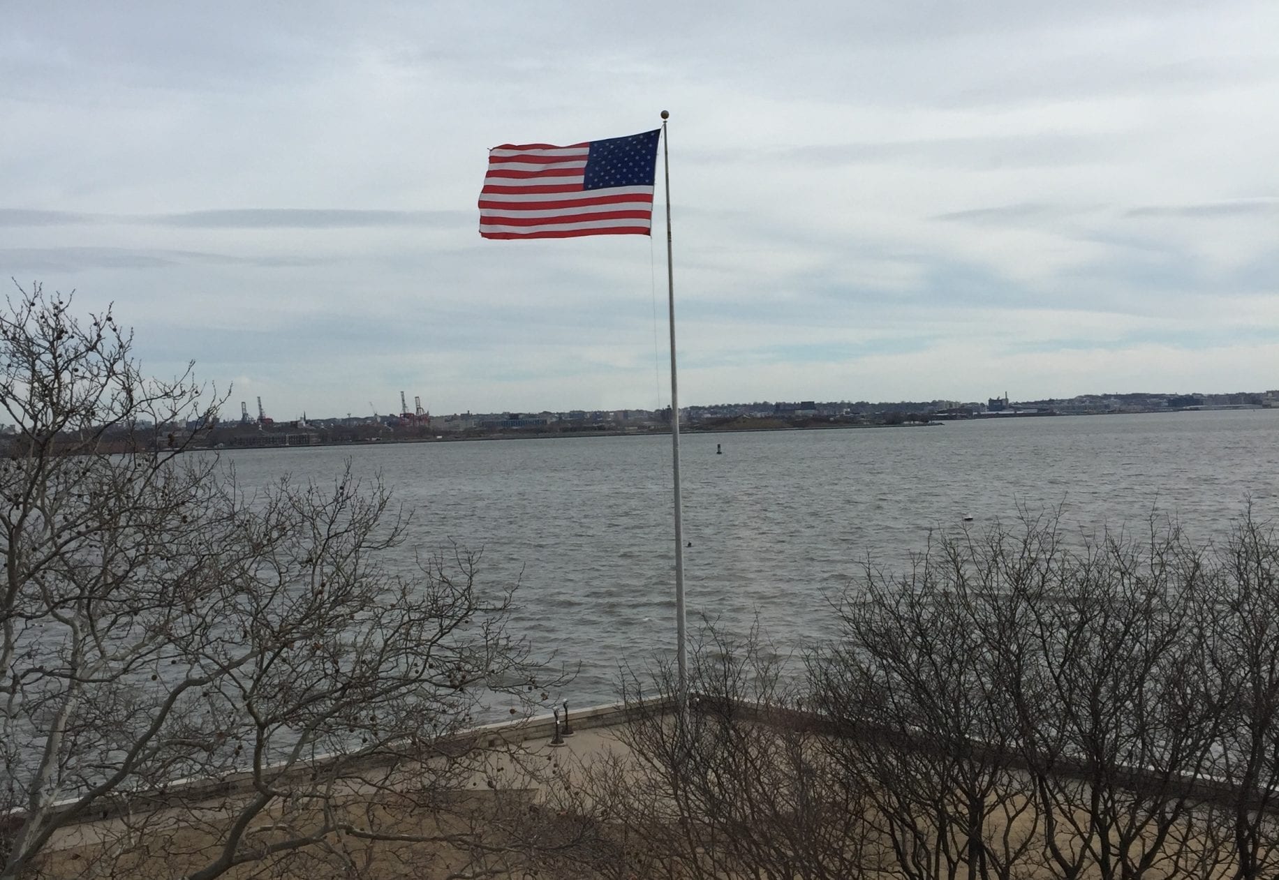 Presidents and the economy: American flag flying in front of the ocean