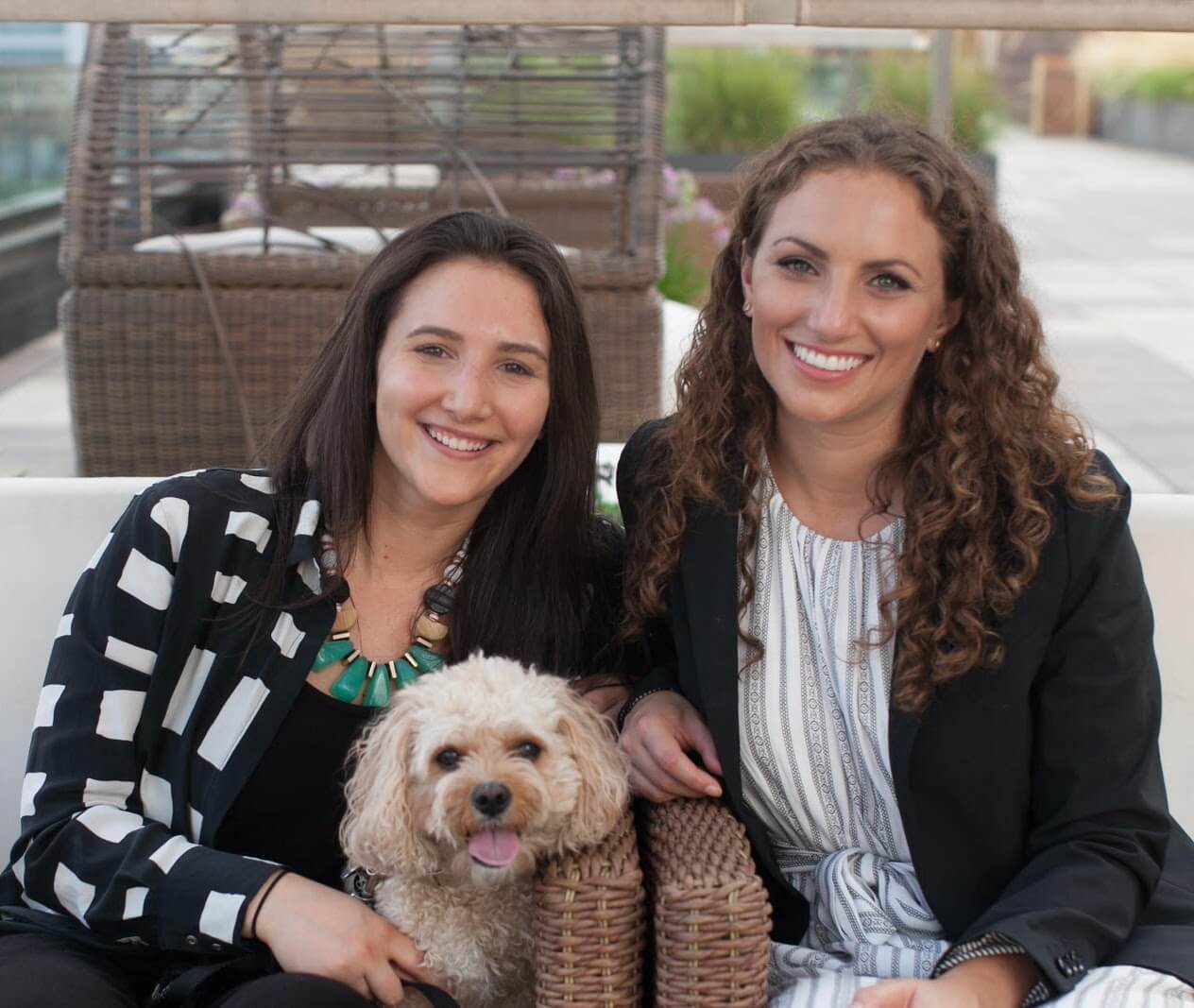 Casey (left) and Leigh Isaacson with dog Layla (center) | National Siblings Day | Working with siblings
